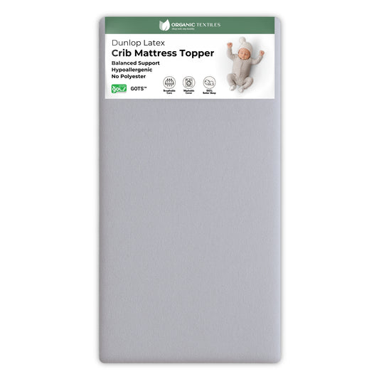 Dunlop Latex crib mattress topper packaging with a label on a white background