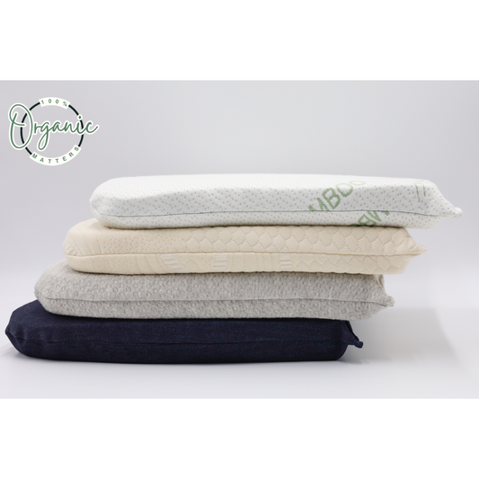 Stack of 100% organic latex seat cushions with cotton, denim, and bamboo covers in various colors on a light blue background